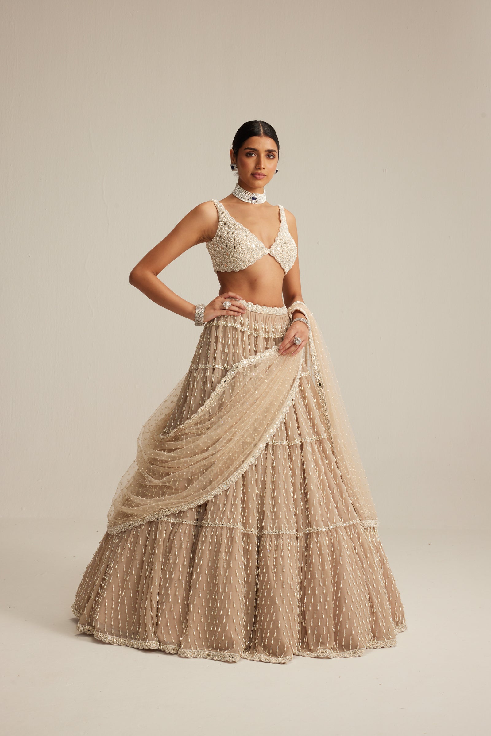 Light Beige Pearl Drop Multi Tier Lehenga Set.