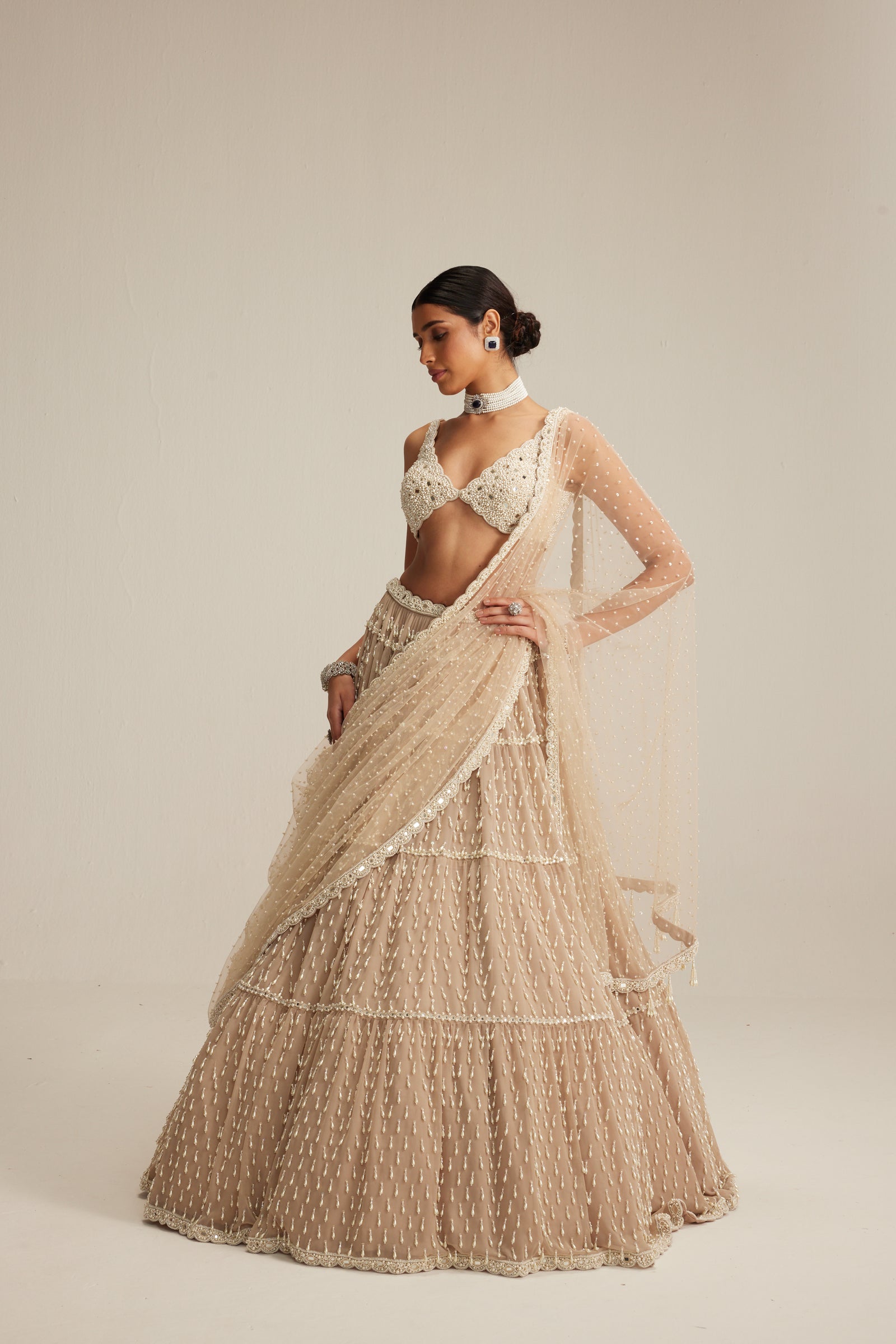 Light Beige Pearl Drop Multi Tier Lehenga Set.
