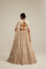 Light Beige Pearl Drop Multi Tier Lehenga With High Neck Blouse Set.
