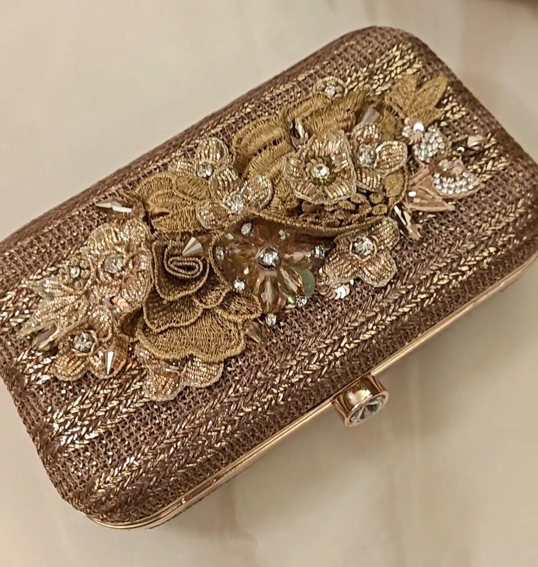 Bronze clutch/sling with a gold frame and a diamond clasp