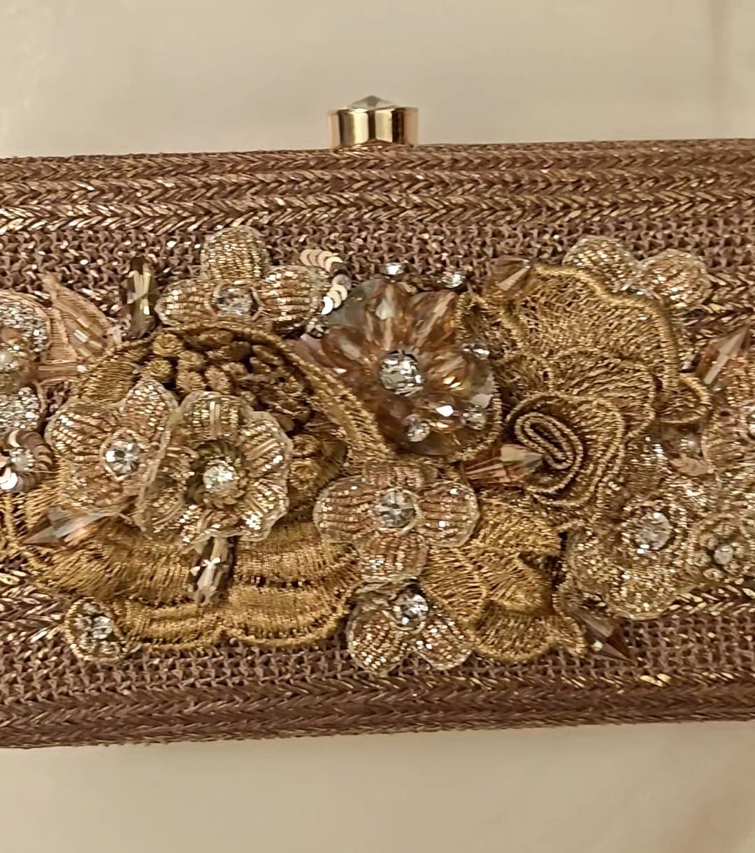 Bronze clutch/sling with a gold frame and a diamond clasp
