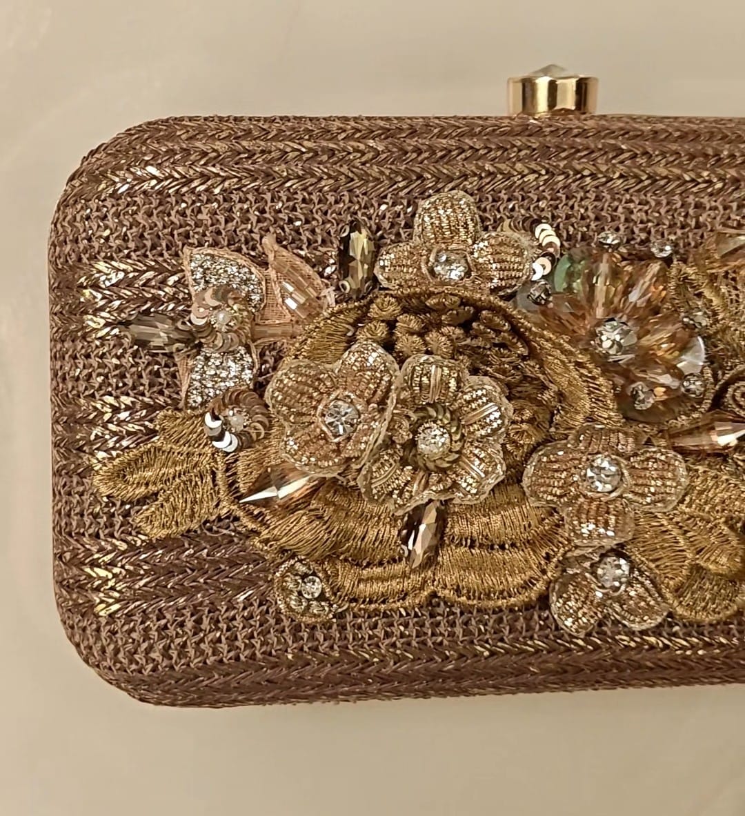 Bronze clutch/sling with a gold frame and a diamond clasp