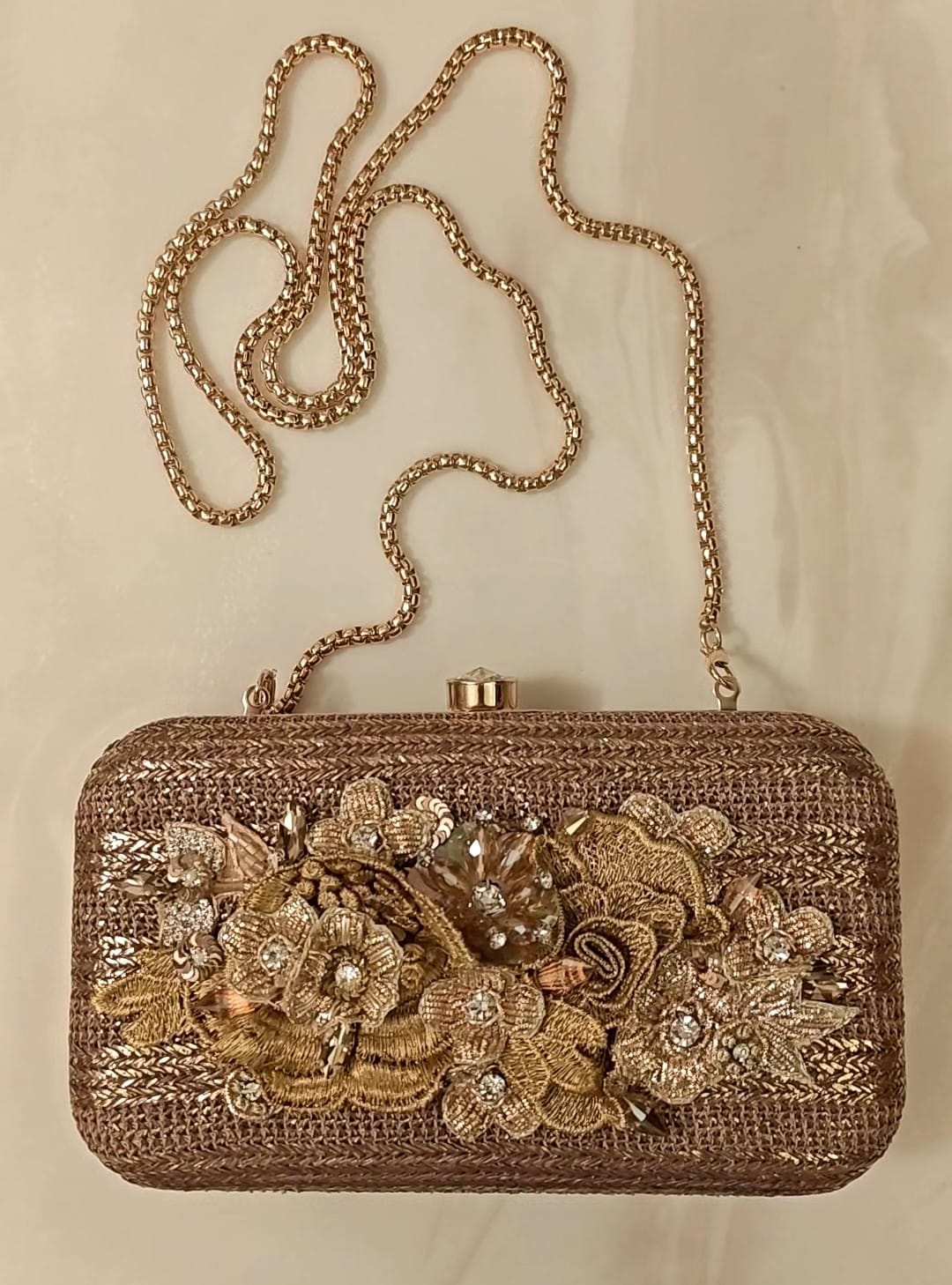 Bronze clutch/sling with a gold frame and a diamond clasp
