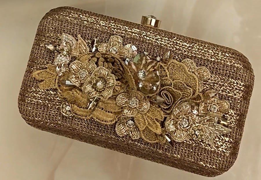Bronze clutch/sling with a gold frame and a diamond clasp