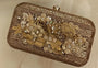 Bronze clutch/sling with a gold frame and a diamond clasp