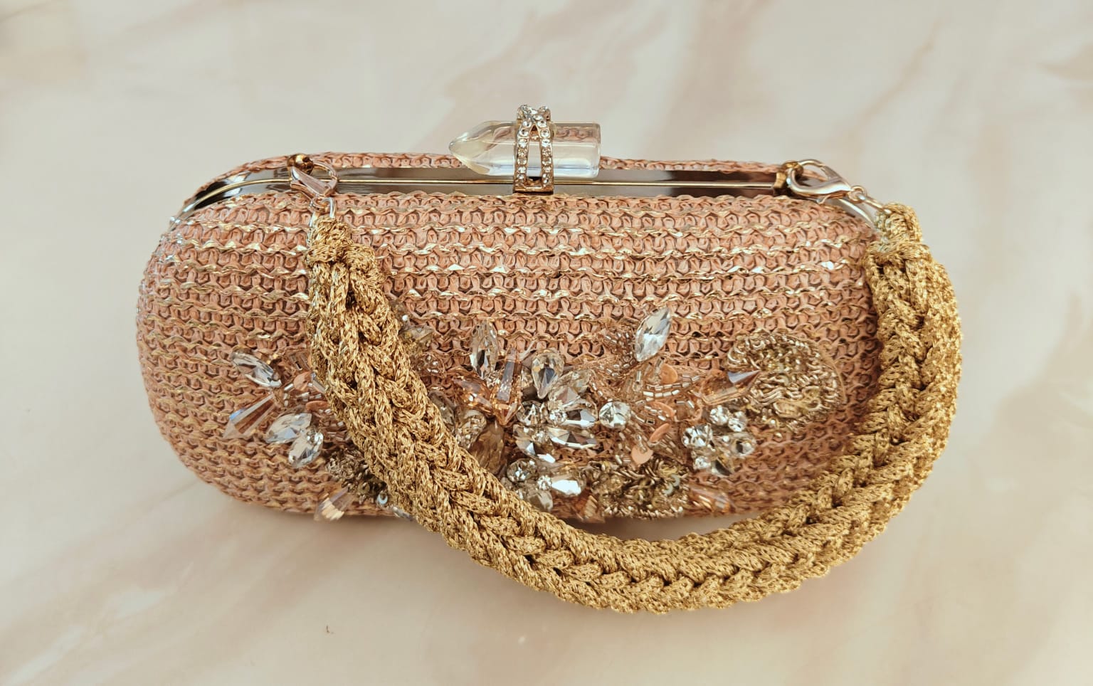 Floral diamond hand embroidered and set in a gold frame with a translucent clasp