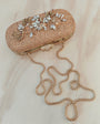 Floral diamond hand embroidered and set in a gold frame with a translucent clasp