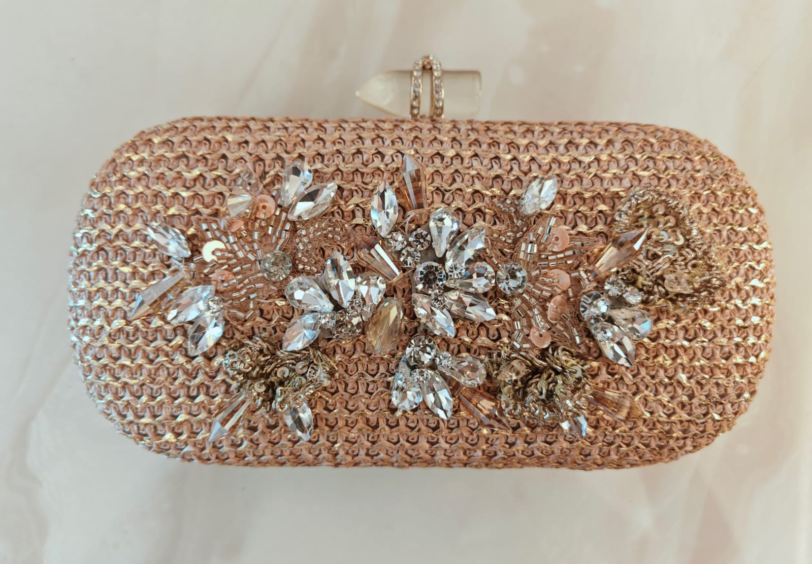 Floral diamond hand embroidered and set in a gold frame with a translucent clasp