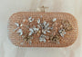 Floral diamond hand embroidered and set in a gold frame with a translucent clasp