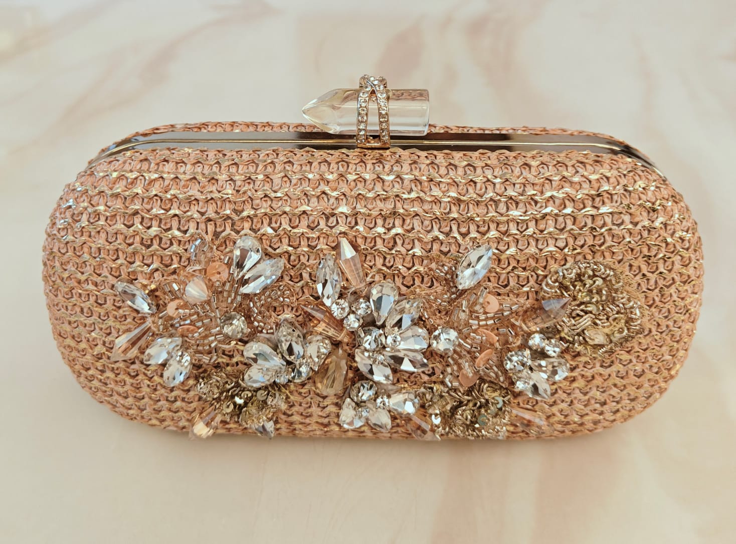 Floral diamond hand embroidered and set in a gold frame with a translucent clasp