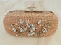 Floral diamond hand embroidered and set in a gold frame with a translucent clasp