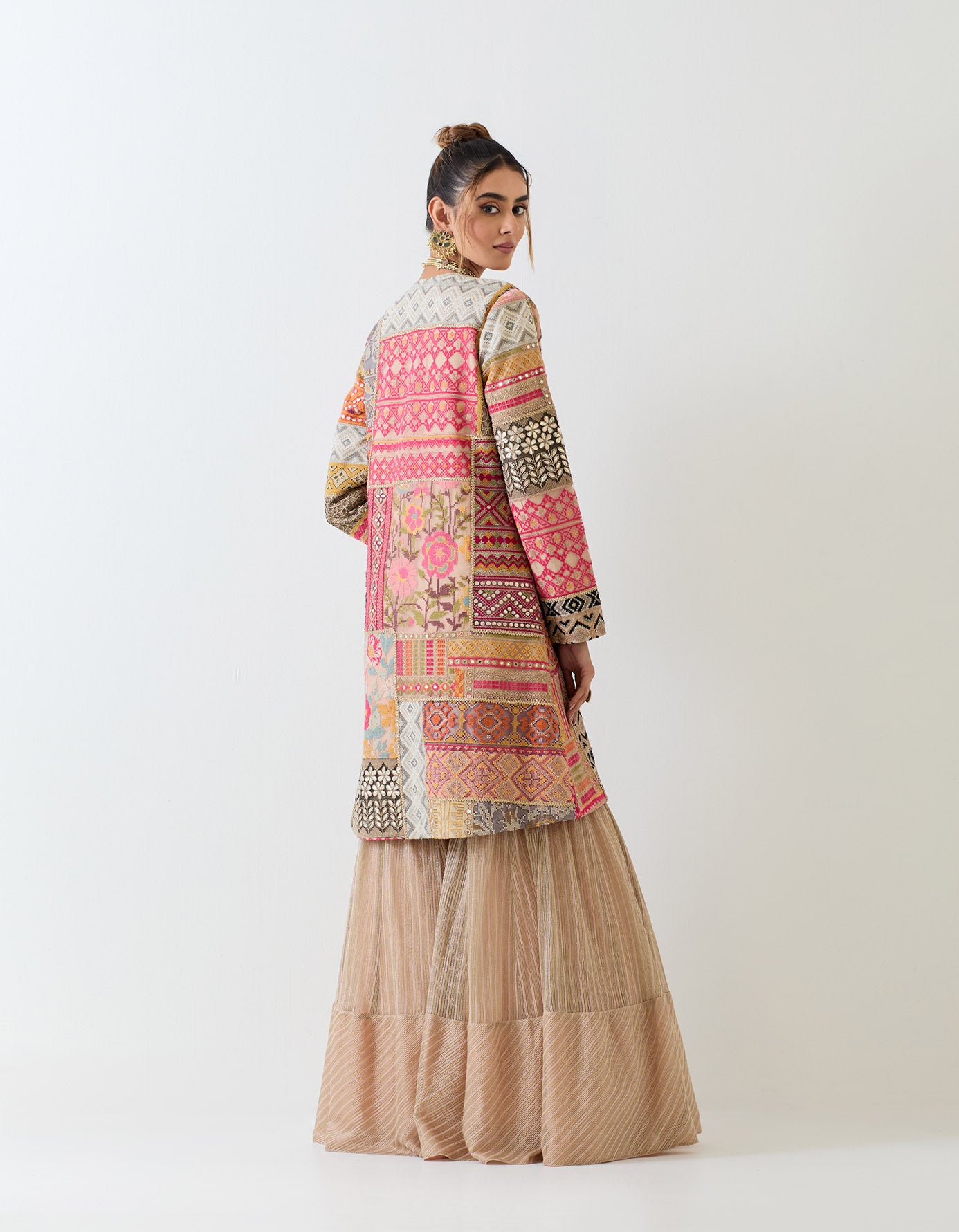 Patch work embroidered long jacket paired with textured sharara pants and patch work embroidered bralet