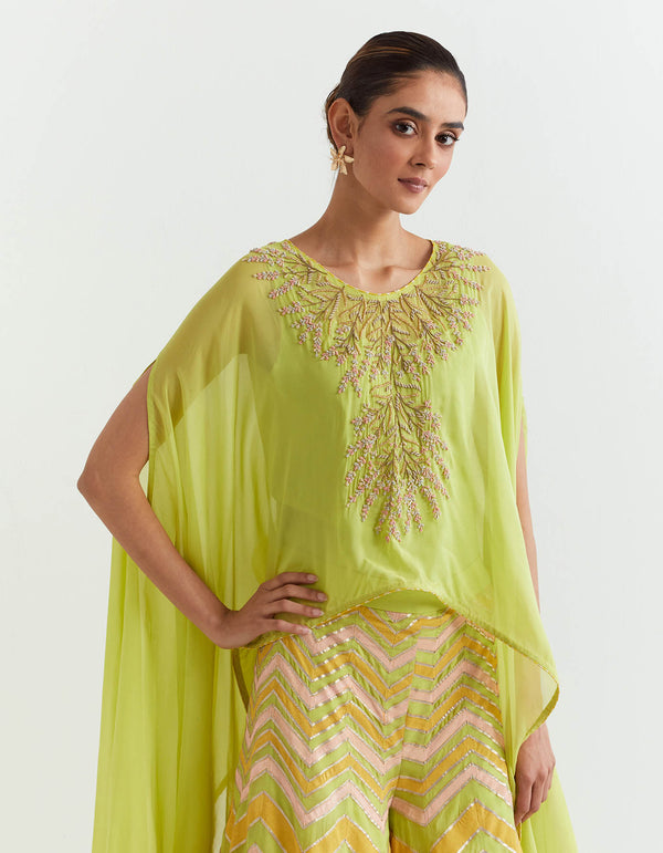 Lime dupatta cape in hand embroidery paired with chevron printed and embroidred sharara pants