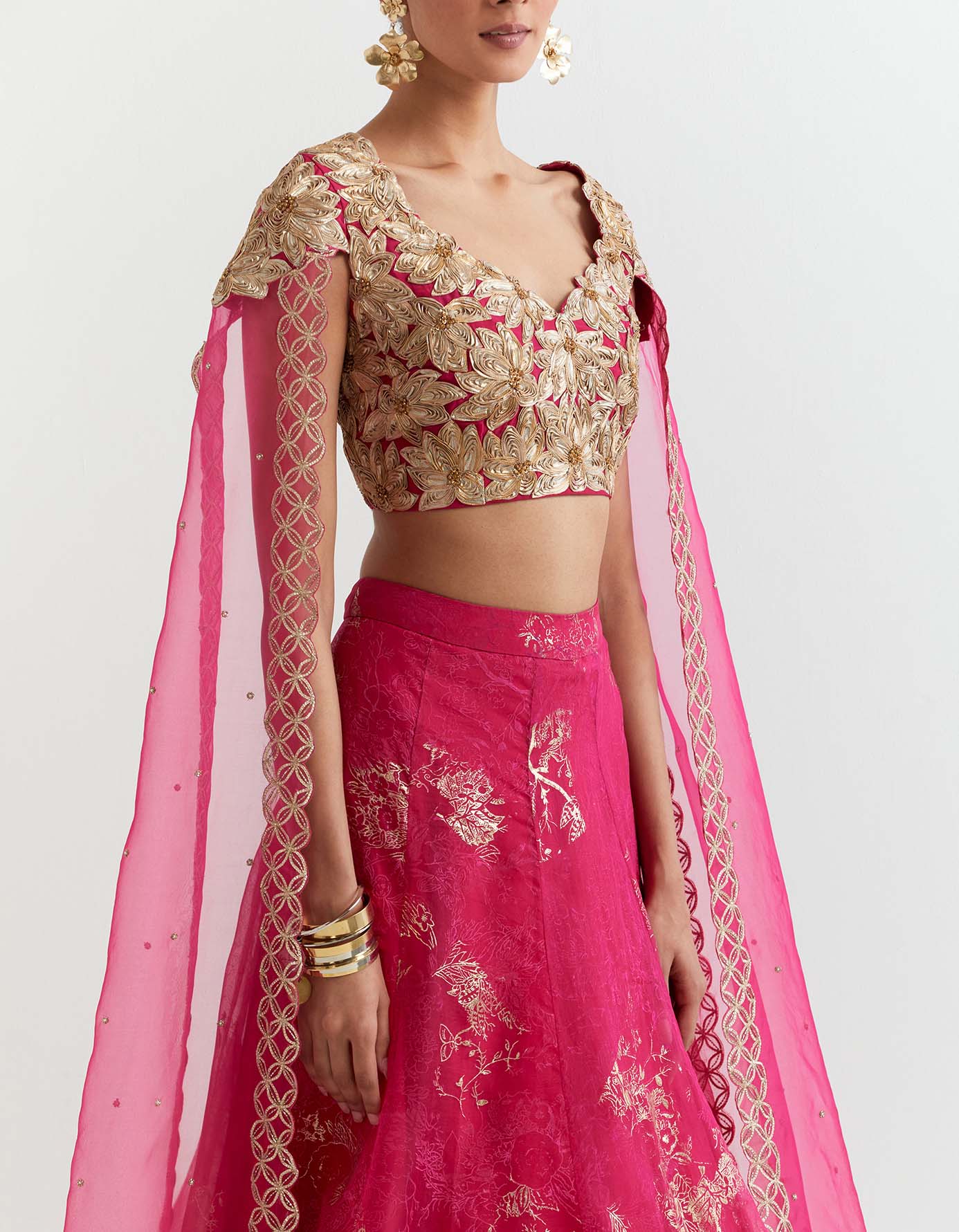 Rosa gota embroidered blouse with attached cape dupatta paired with organza silk gota embroidered skirt