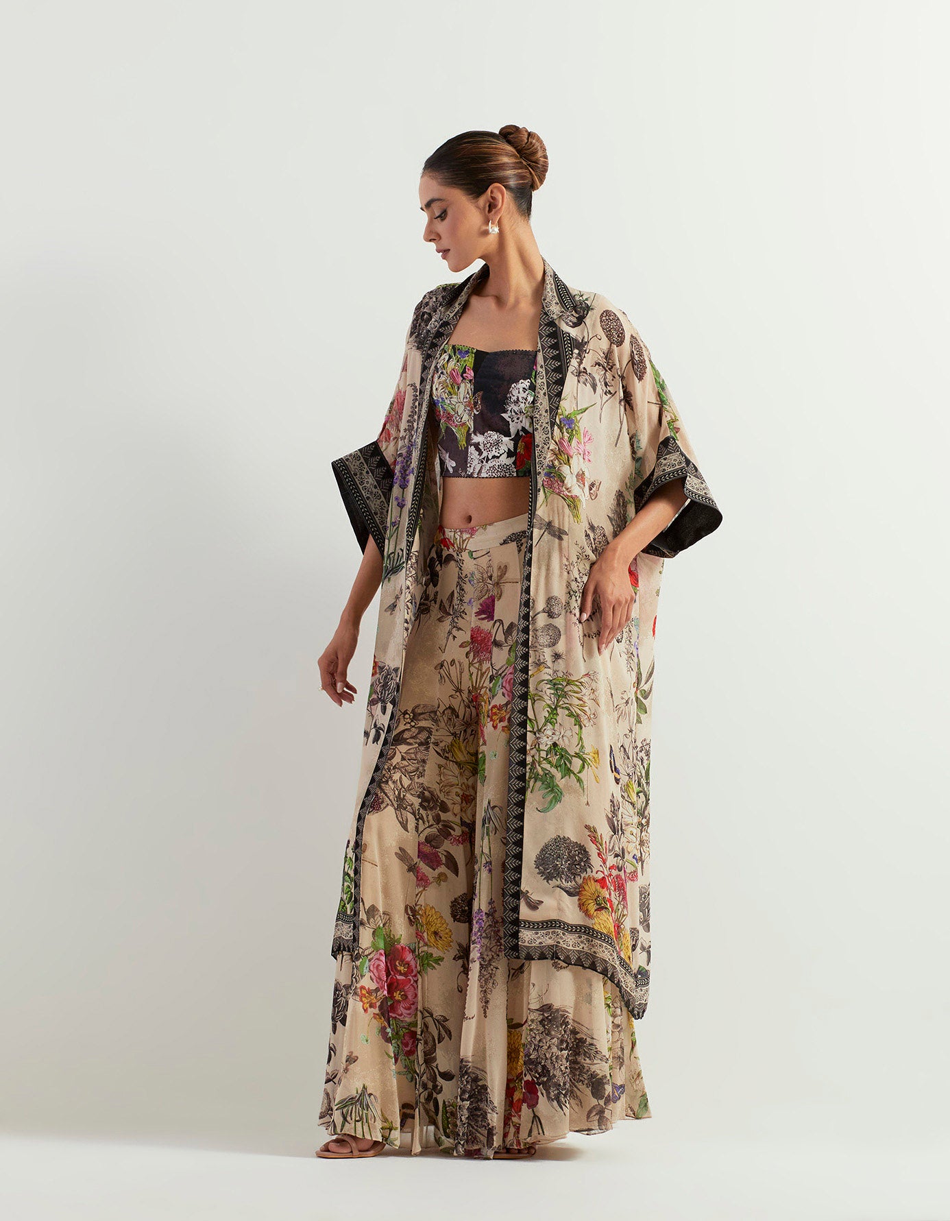 Long cape paired with stretch tube top and flaired sharara pants