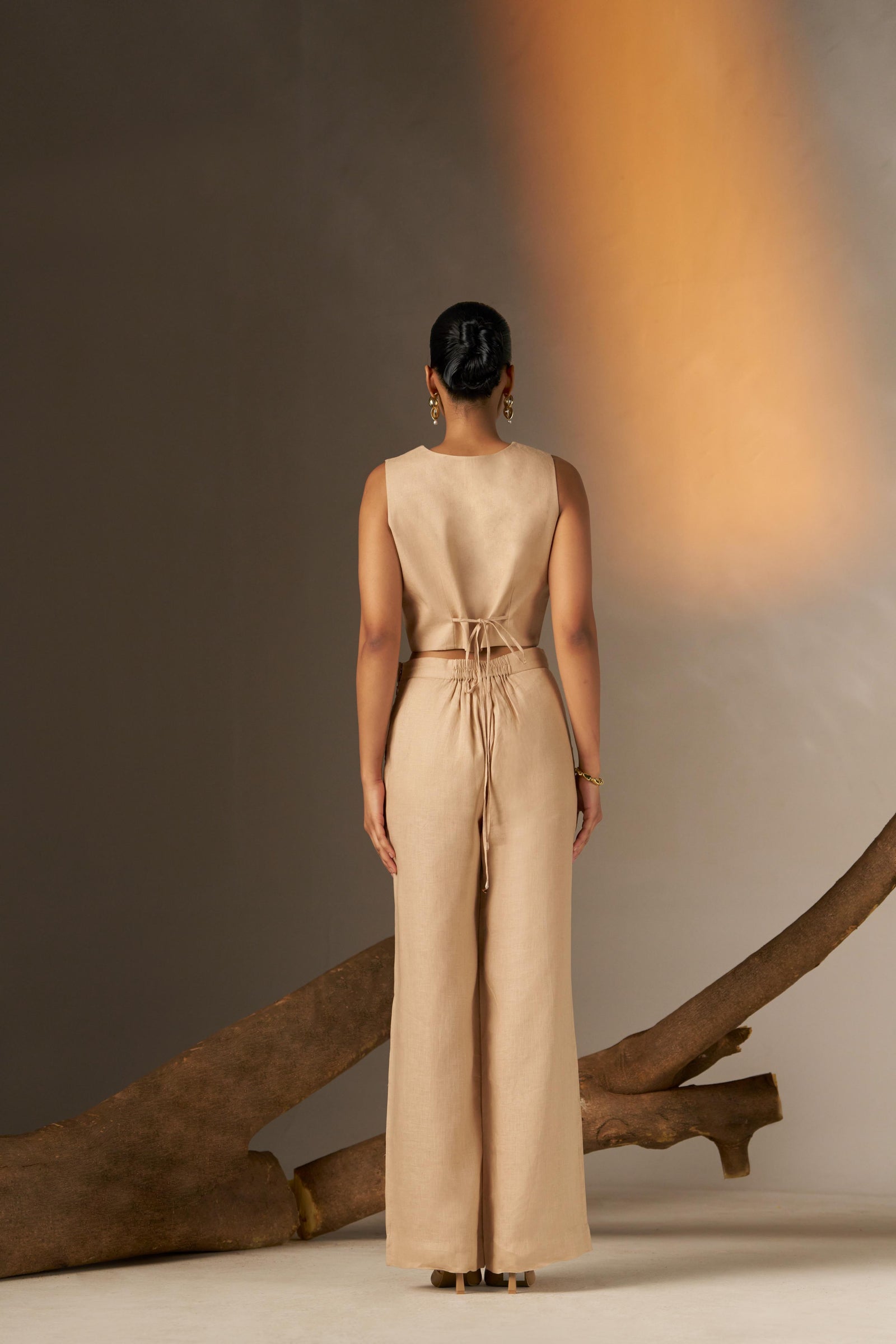 A Sleek And Sophisticated Soft Cosmic Latte Hue, Featuring A Tailored Pant