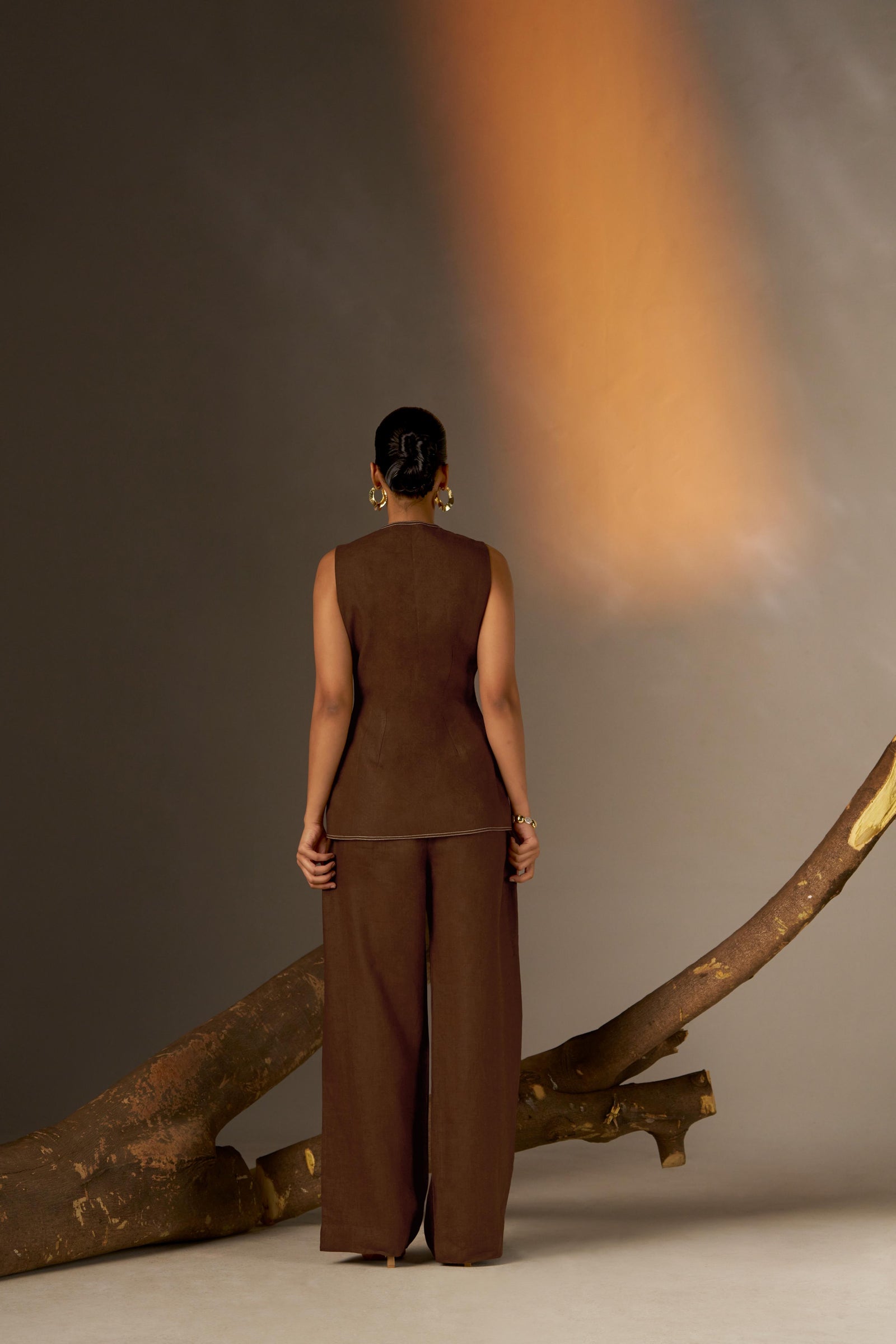 A Sophisticated Sepia-Toned Long Vest With A Closed Neck