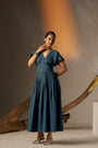An Elegant Dress In Rich Midnight Blue, Featuring A Defined Waistline And Soft Cap Sleeves For A Feminine, Tailored Look