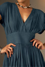An Elegant Dress In Rich Midnight Blue, Featuring A Defined Waistline And Soft Cap Sleeves For A Feminine, Tailored Look