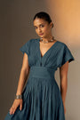 An Elegant Dress In Rich Midnight Blue, Featuring A Defined Waistline And Soft Cap Sleeves For A Feminine, Tailored Look