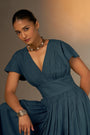 An Elegant Dress In Rich Midnight Blue, Featuring A Defined Waistline And Soft Cap Sleeves For A Feminine, Tailored Look