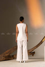 An Elegant White Sleeveless Long Vest Adorned With Delicate Floral Embellishments
