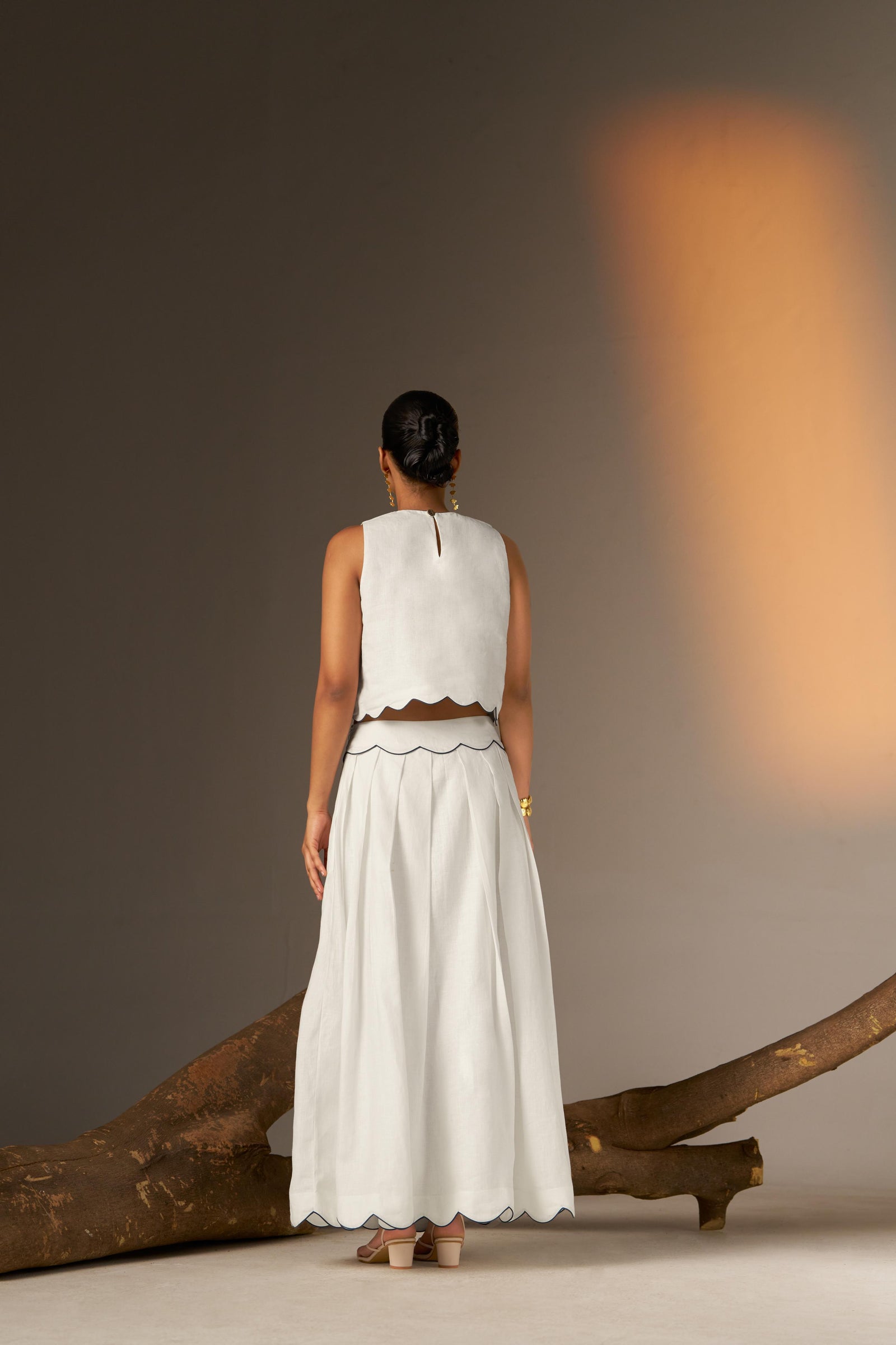 A Flared Skirt With Subtle Blue Finishing For A Crisp, Contemporary Touch